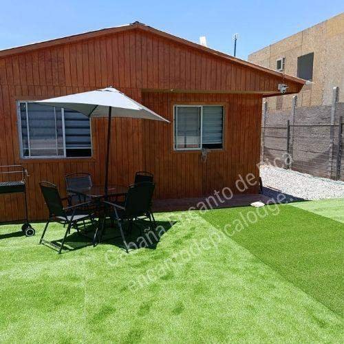 Zona exterior con parrilla de Encanto de Pica Lodge